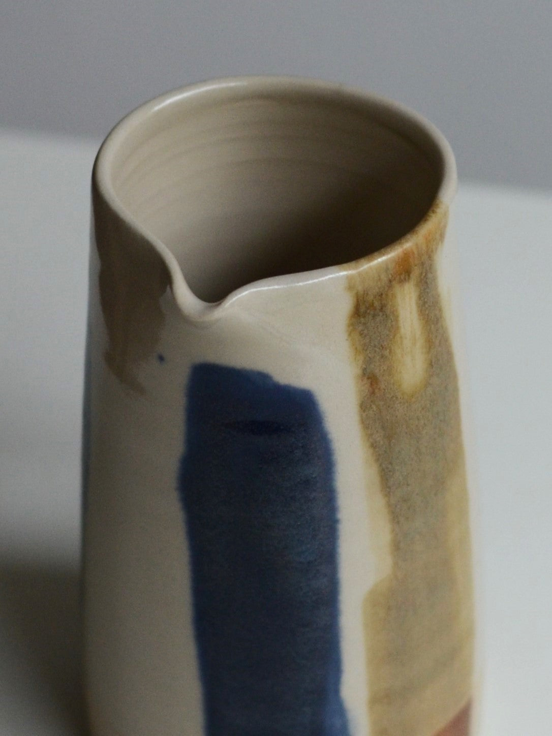Yellow and blue striped jug
