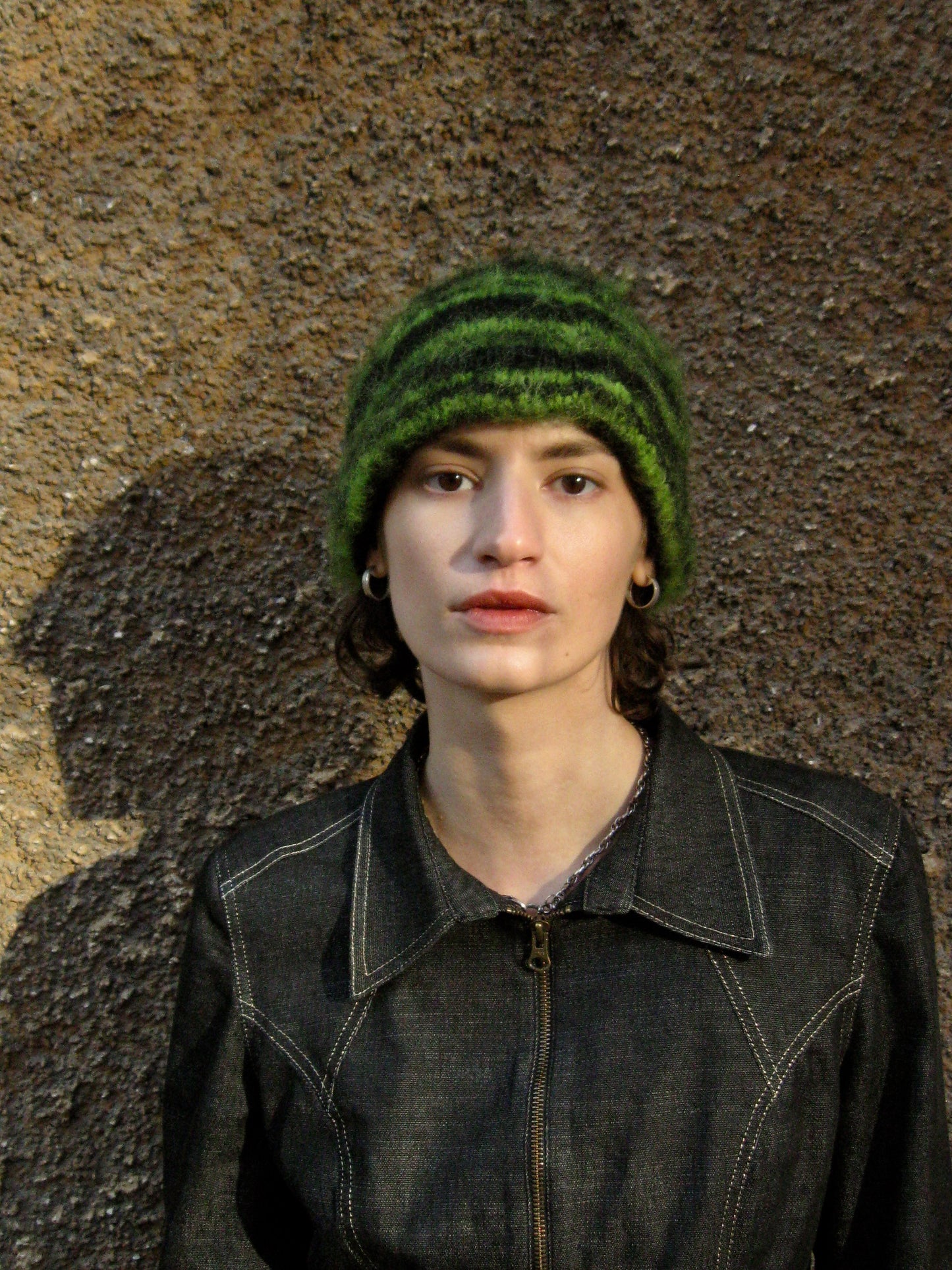 Black beanie with green stripes