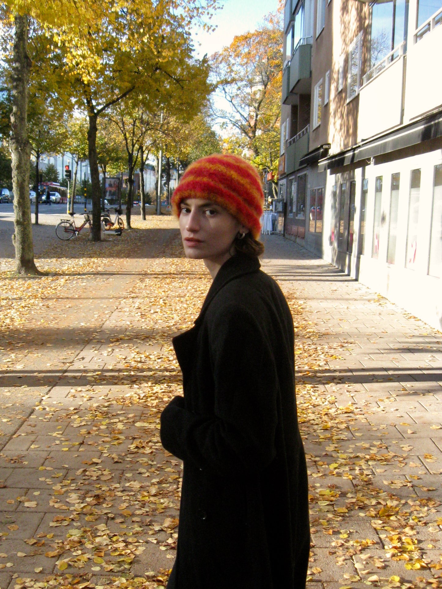 Red beanie with orange stripes