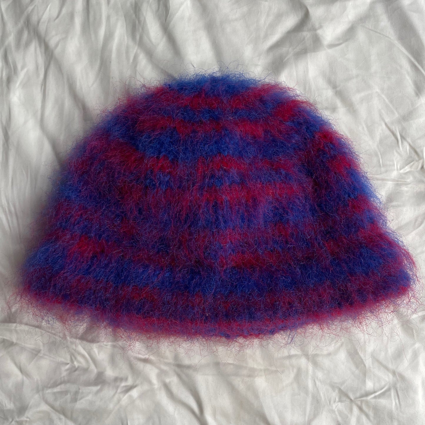 Blue beanie with red stripes