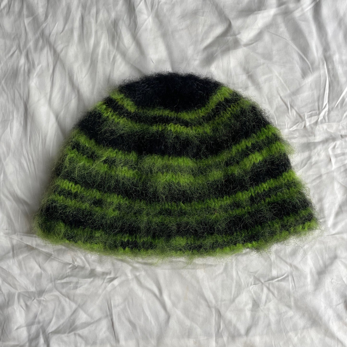 Black beanie with green stripes