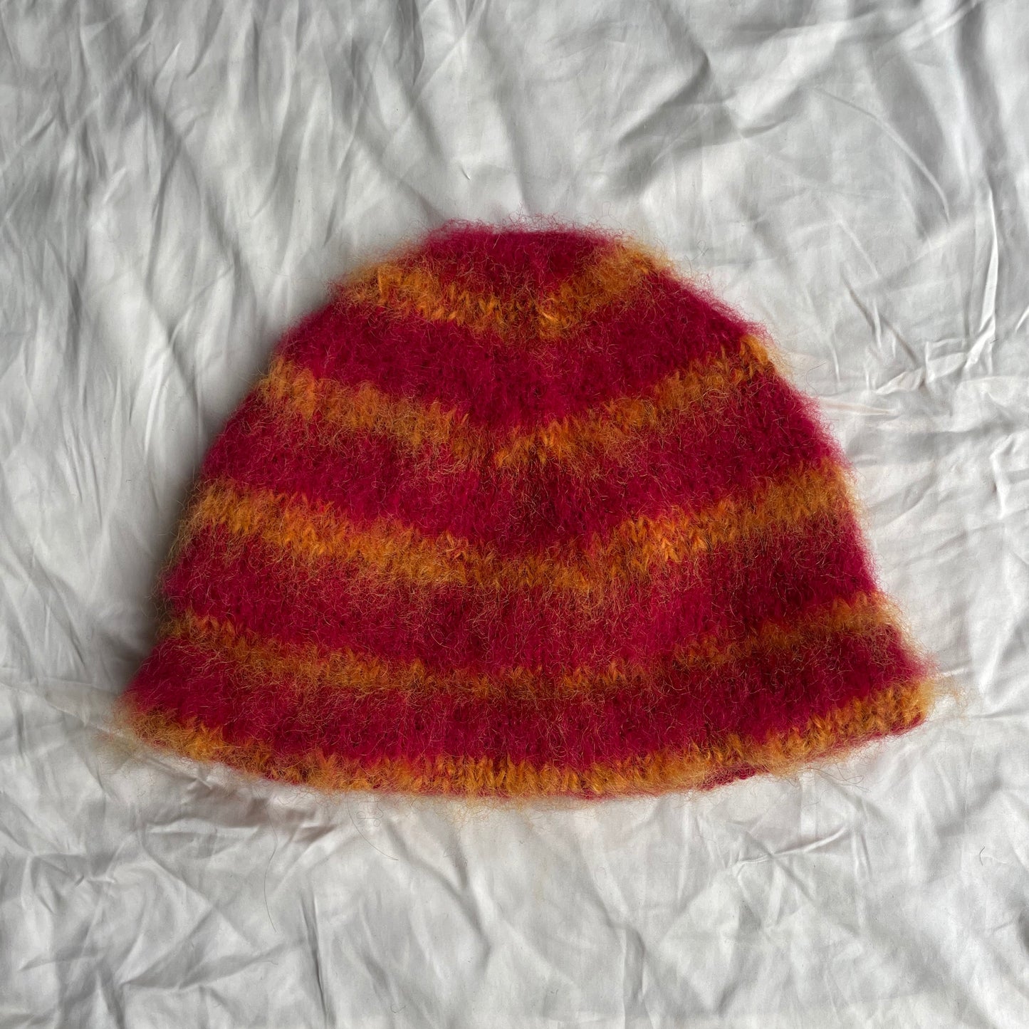 Red beanie with orange stripes