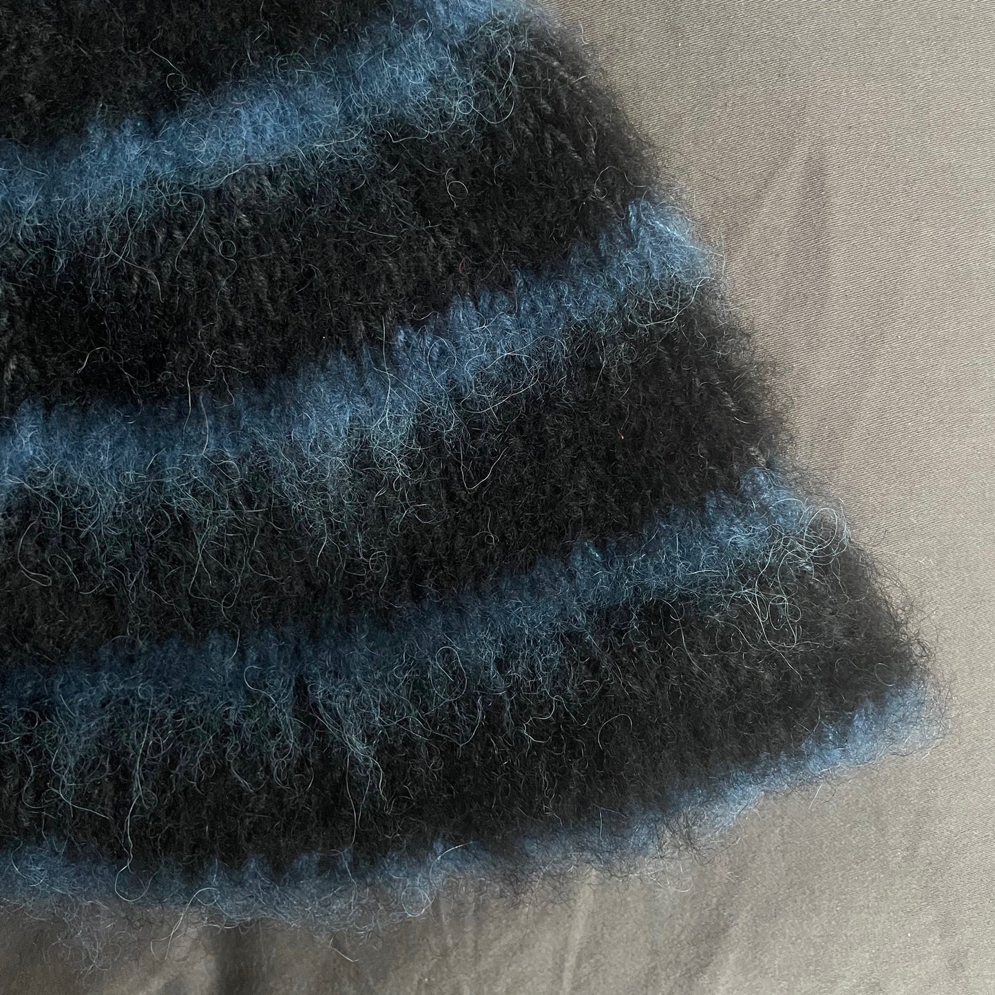 Black beanie with blue stripes