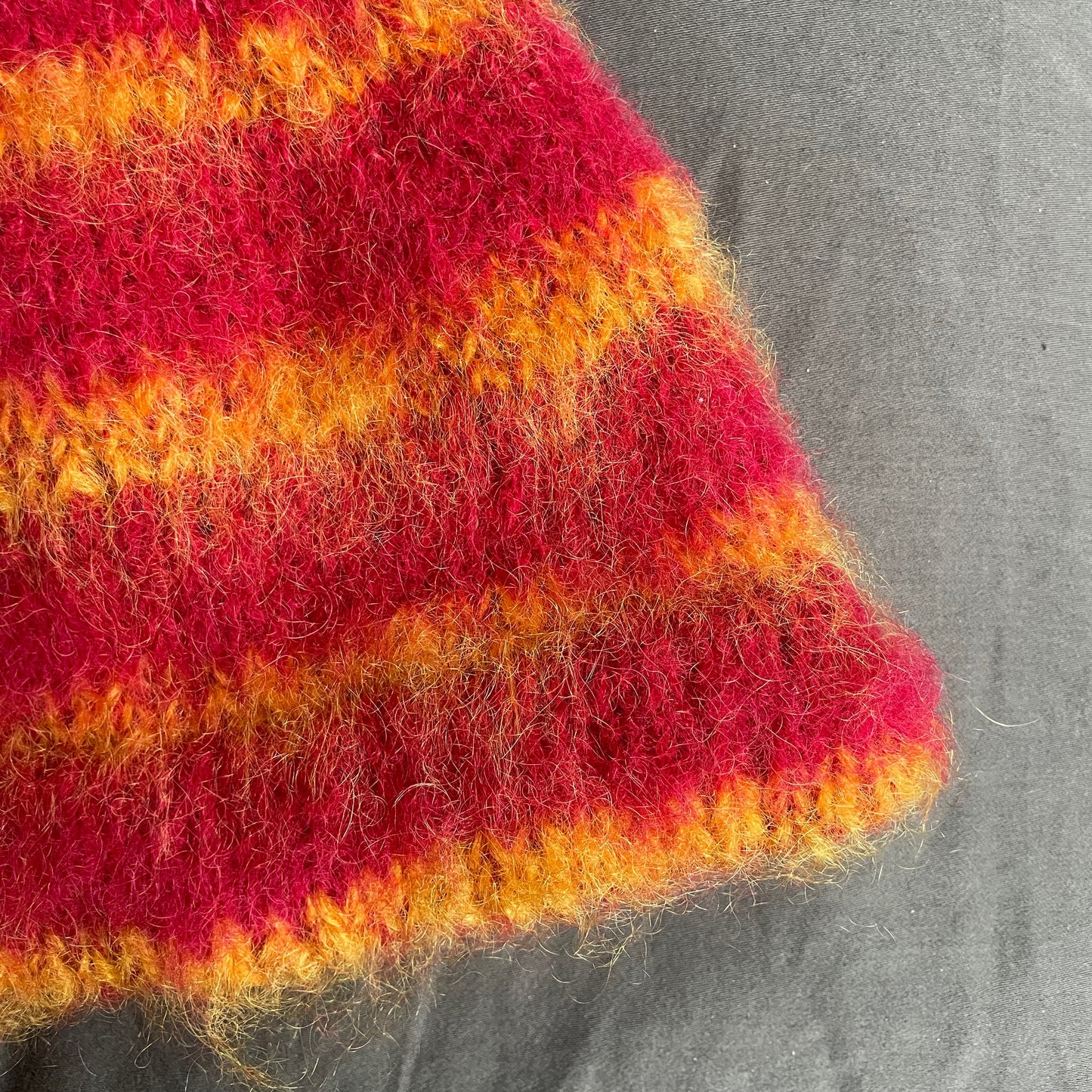 Red beanie with orange stripes