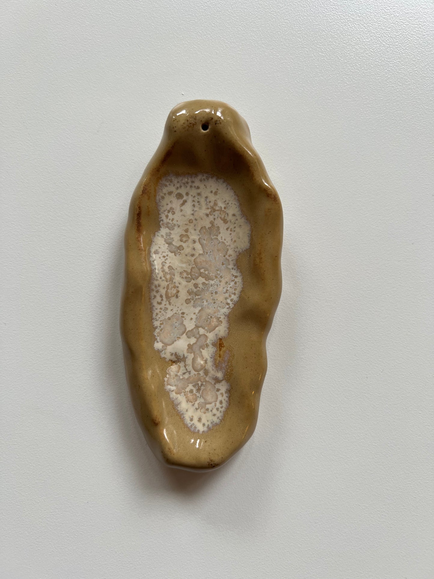 beige incense holder