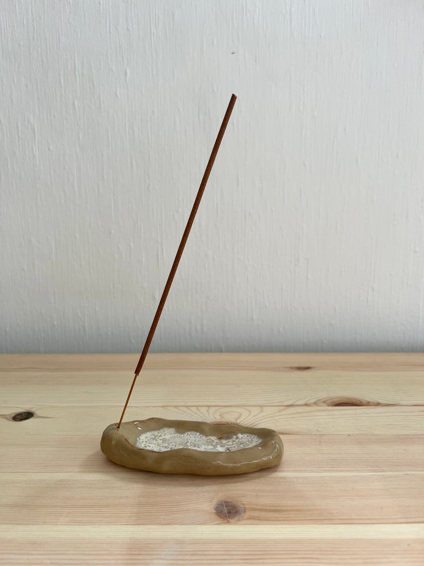 beige incense holder