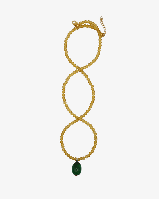 Oliv- och guldfärgade pärlhalsband