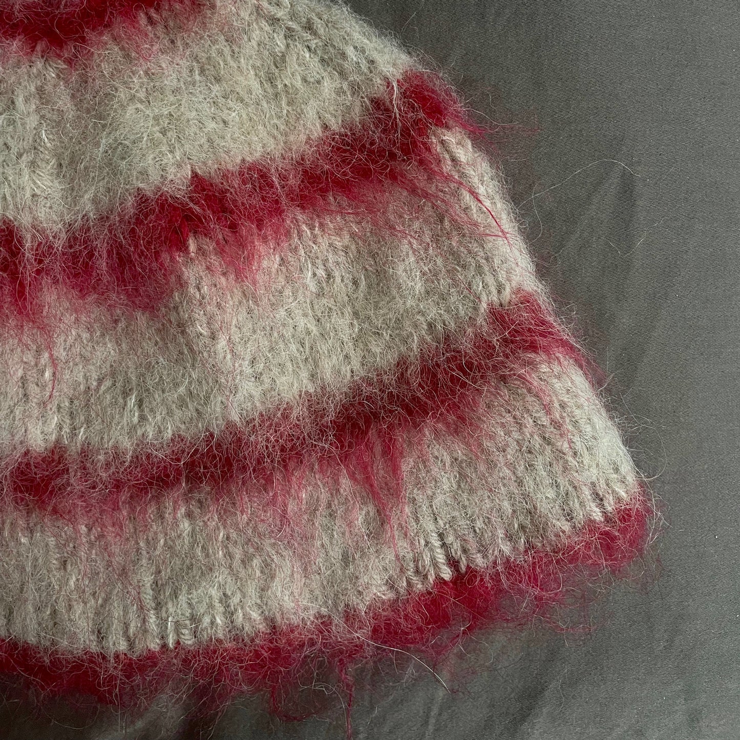 Beige beanie with red stripes
