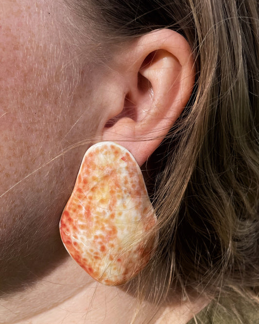 Hammered shell orange earrings